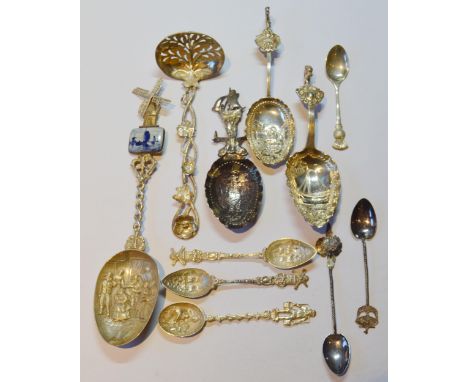 Dutch silver caddy spoon, c. 1900, surmounted by a sailing ship, two other Dutch silver caddy spoons, an unmarked Dutch Delft