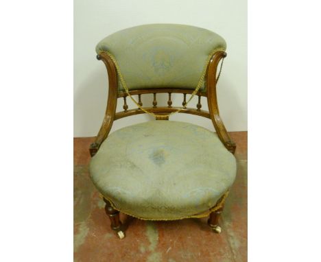 Victorian walnut and amboyna lady's drawing room chair, with open balustrade back rest, upholstered in later fabric, on turne