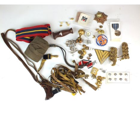 A mixed lot of insignia, uniform and various parts comprising SA Dagger handle, roll of khaki cloth, helmet finial, a First W