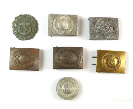 A group of assorted German belt buckles, including post-war comprising a Wehrmacht Officer's circular brocade parade belt buc