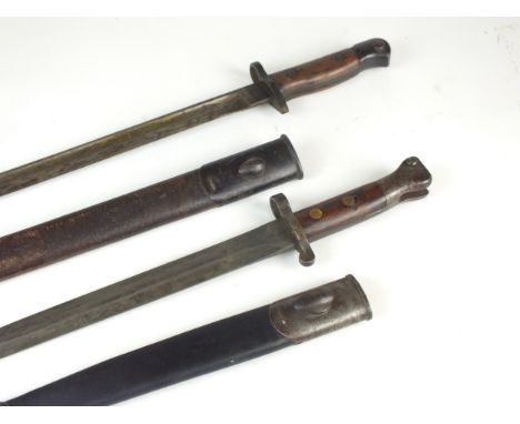 A British P1907 bayonet by Chapman dated 1915, blade length 42.5cm, housed in the original leather scabbard with oval frog st
