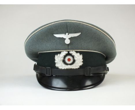 A German Third Reich Infantry NCO's visor cap manufactured by Pekuro and contracted by F. Eckhard Hanau constructed of field 