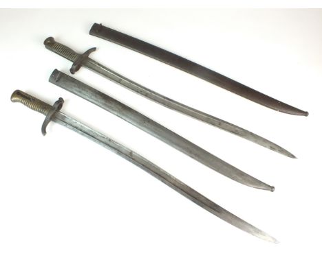 Two 19th century French chassepot yataghan sword bayonets with scabbards, comprising a St. Etienne arsenal example dated 1867