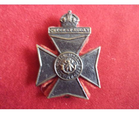 The King's Royal Rifle Corps WWI Cap Badge (Blackened-brass, red felt backing), slider. K&amp;K: 674