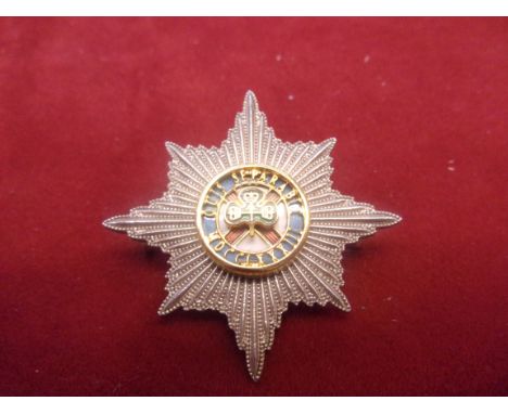 The Royal Fusiliers (City of London Regiment) WWI Cap Badges, two. Regular and Other Ranks (Gilding-metal and White-Metal) K&