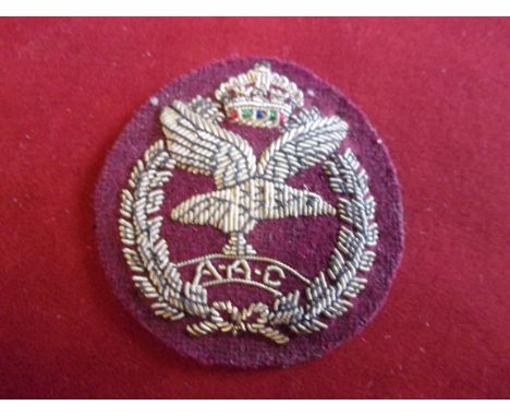 Army Air Corps WWII Cap Badge (Red cloth and silver bullion). Design sealed 27th May 1942. K&amp;K: 2055
