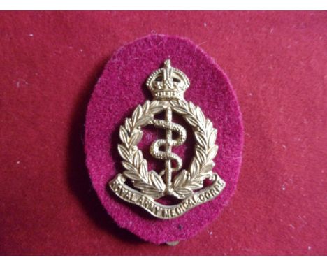 Royal Army Medical Corps WWI Forage Cap Badge (Gilding-metal with red cloth backing), two lugs. K&amp;K: 1007