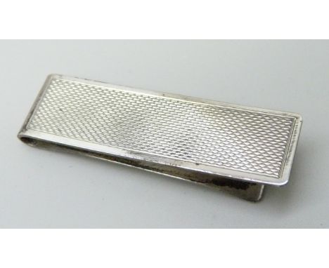 A silver money clip, Birmingham 1979