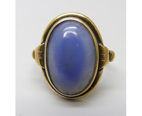 A silver gilt, blue cabochon ring, R