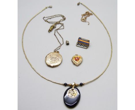 A 9ct gold back and front locket, a plated locket and a jade pendant and chain