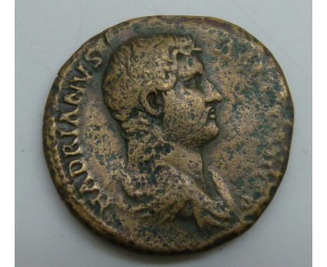 Coins; an ancient Hadrian Sestertius (117-138AD), Laureate bust of Hadrian, reverse Hadrian clasping hands with Felicitas