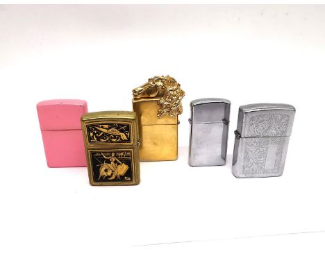 A collection of five Zippo (USA) lighters, a matte pink design, Spanish bull fighter, a Vasilia gold plated limited edition h