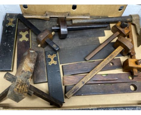 A box of vintage hand tools, to include squares and levels