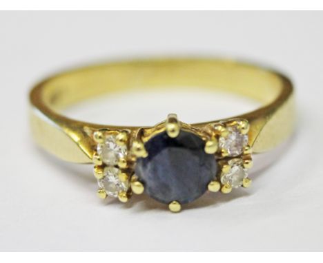 An 18ct gold diamond sapphire ring, size M, gross wt. 3.9g.