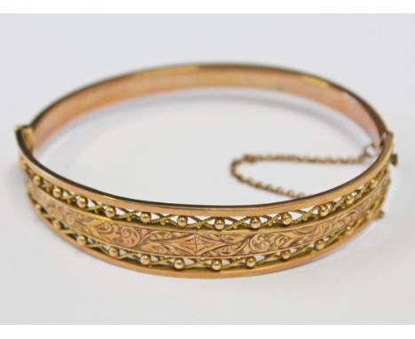 An early 20th Century 9ct gold bangle, diam. approx. 6cm, wt. 11g.