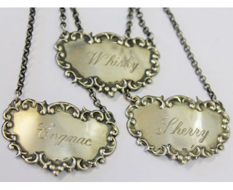 A set of three Continental hallmarked silver decanter labels.