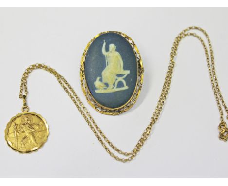 A 9ct gold mounted Wedgwood pendant length 4.4cm and a 9ct gold religious pendant and chain, wt. 6g.