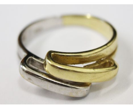 A two colour gold ring marked '585', size N, wt. 4.2g.