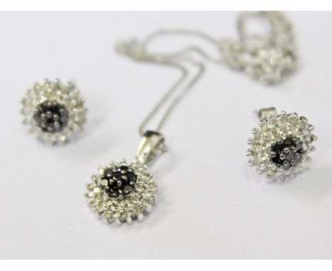 A pair of 9ct white gold diamond and sapphire earrings with matching pendant on chain, gross wt. 4g.