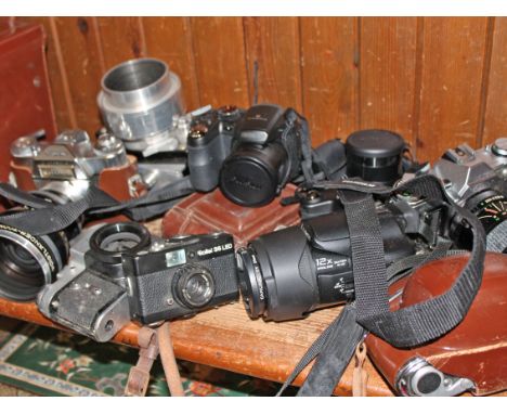 Two boxes of various camera equipment.