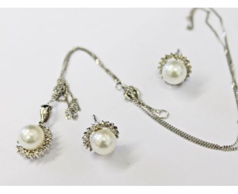 A pair of 9ct white gold and simulated pearl earrings and matching pendant on chain, gross wt. 3.6g