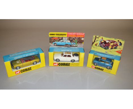 Three Corgi Toys diecast model cars: 275 Rover 2000 275 in white with red interior; 335 Mini Cooper Magnifique in blue with c