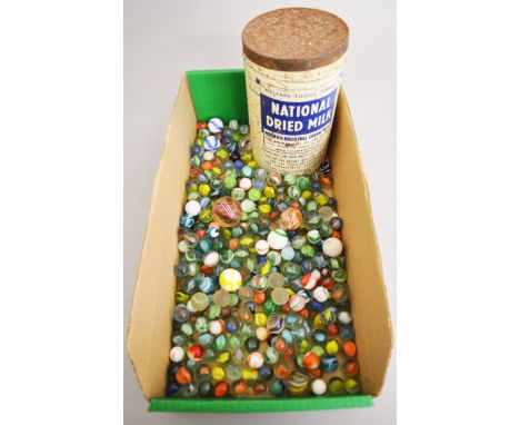 A good quantity of glass marbles, mainly c.1950s, together with the vintage Welfare Foods Service National Dried Milk tin the