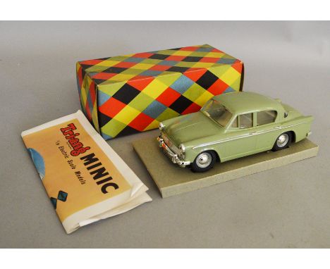 A boxed Tri-ang 'Minic Electric' Hillman Minx green plastic bodied battery operated car in 1:20 scale, appears G+ in G/G+ 'Ha