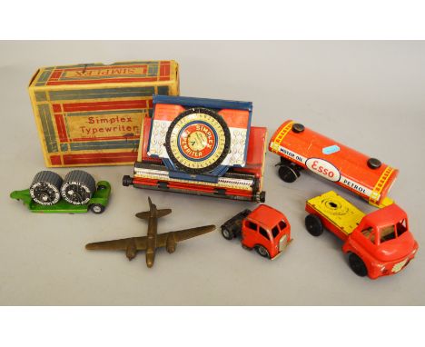 A boxed 'Simplex' (USA) tinplate Typewriter together with three unboxed items, A Wells Brimtoy tinplate and plastic Bedford '