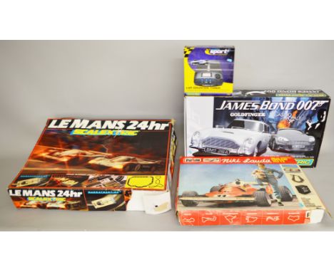 Two boxed Scalextric Sets,'Le Mans 24hour' and 'James Bond 007 Goldfinger /Casino Royale' together with a boxed Polistil Slot