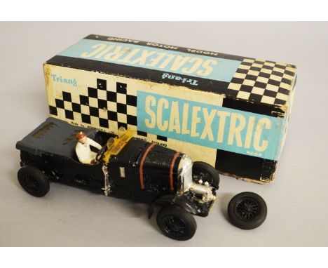 Triang Scalextric C64 Bentley with black body, black seats and white driver. Some paint lifted from tonneau, only one mud gua
