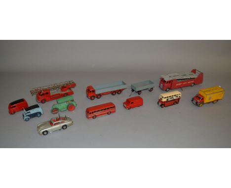 Eleven unboxed playworn Dinky Toys diecast models, some with damage and evidence of repainting, including a 901 Foden Wagon a