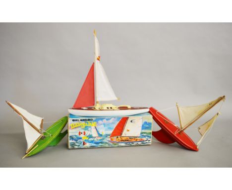 A vintage boxed Giner (Spain) Pond Yacht, 40cm approx, of metal wood and plastic construction, generally G+ in G box, togethe