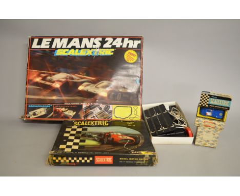 Two boxed Scalextric Sets, a vintage Grand Prix set, including yellow and blue Lotus cars,  a later 24hr Le Mans set includin