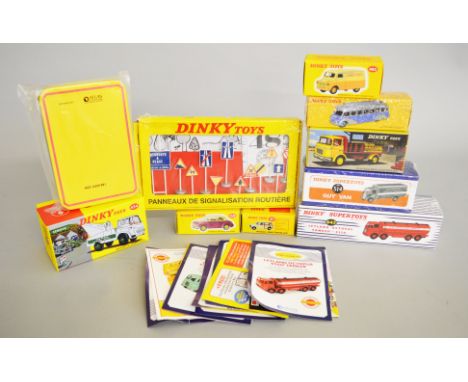 Eight boxed Atlas Editions 'Dinky Toys' diecast models including 434 Bedford TK Crash Truck, 514 Guy Van and 943 Leyland Octo