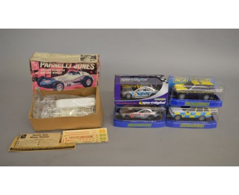 Five slot cars: four Scalextric (C3116 Mercedes SLR, C2808 Range Rover Police Car, C2877 Range Rover HM Coastguard, C2567D Me