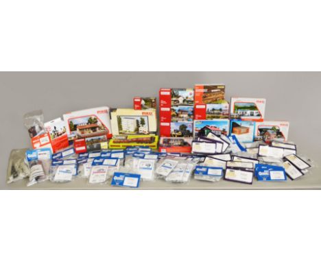 A good quantity of boxed and bagged HO/OO railway related model kits by Piko, Auhagen, Kibri and others including approximate