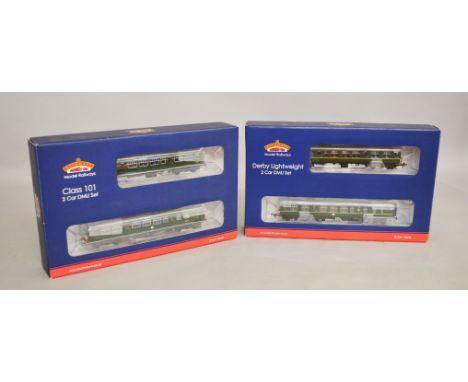 OO gauge. Two Bachmann DCC ready BR green Two Car DMUs: 32-286 Class 101 DMU; 32-515A Derby Lightweight DMU. Both appear E an