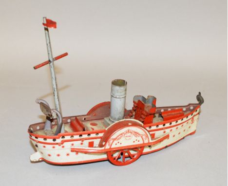 An unboxed vintage tinplate clockwork Paddle Steamer model by OROBR (Germany), approximately 20cm long, with the number '120'