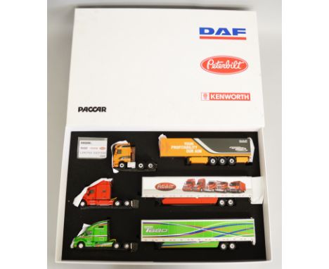 WSI 02-1753 Paccar gift set, comprising three 1:50 scale tractor units (DAF, Peterbilt and Kenworth) with box trailers and ce