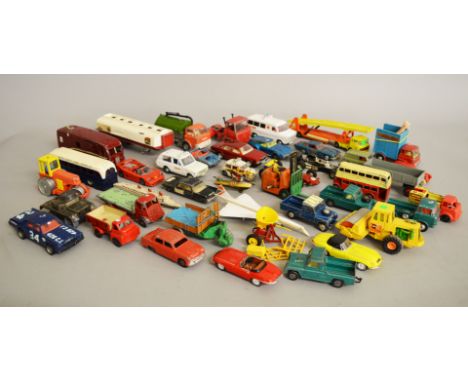 A quantity of unboxed  diecast and plastic models by Dinky, Corgi and others, with varying degrees of play wear, contained in