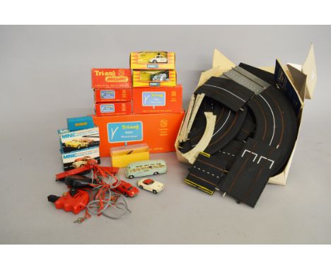 A good quantity of Tri-ang Minic Motorway items including seven boxed vehicles, Routemaster Bus, Police Car with light, Rolls