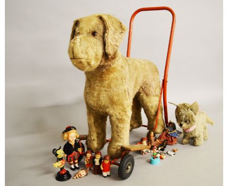 A mixed lot of toys: Triang push along dog; Chiltern dog; Bakelite Minnie Mouse; costume dolls; Frozen Charlotte doll; etc. 