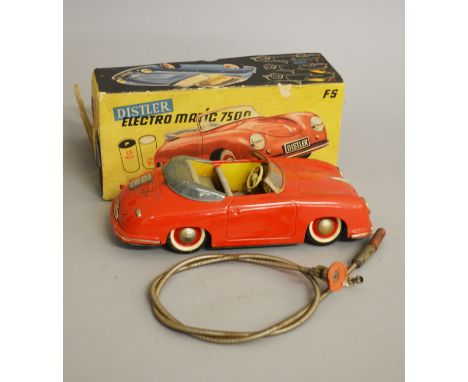 A boxed Distler 'Electro Matic 7500' steerable tinplate battery operated car with detailed interior approximately 25cm long. 