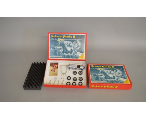 Schuco Studio II #01222 'Montagekasten' clockwork tinplate racing car kit. Boxed and VG.