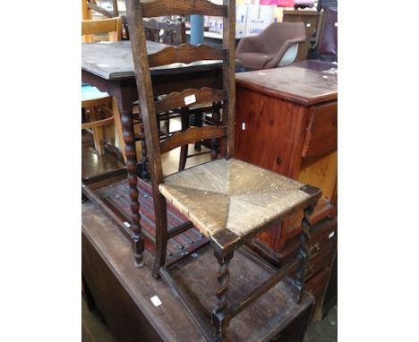 A RUSH LADDER BACK CHAIR