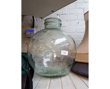 A GLASS CARBOY/PLANTER