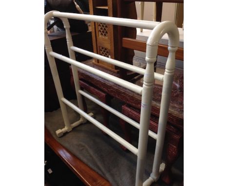 A PAINTED TOWEL RAIL AND A STANDARD LAMP