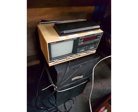 A SONY MUSIC SYSTEM AND A SMALL TV RADIO