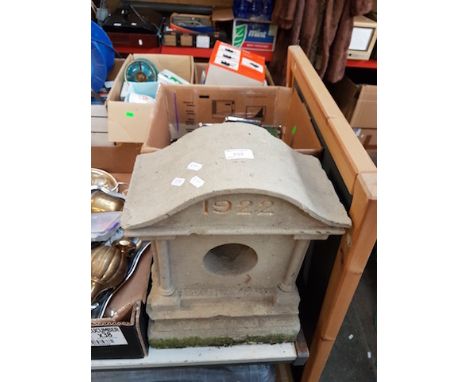 A SANDSTONE CLOCK CASE